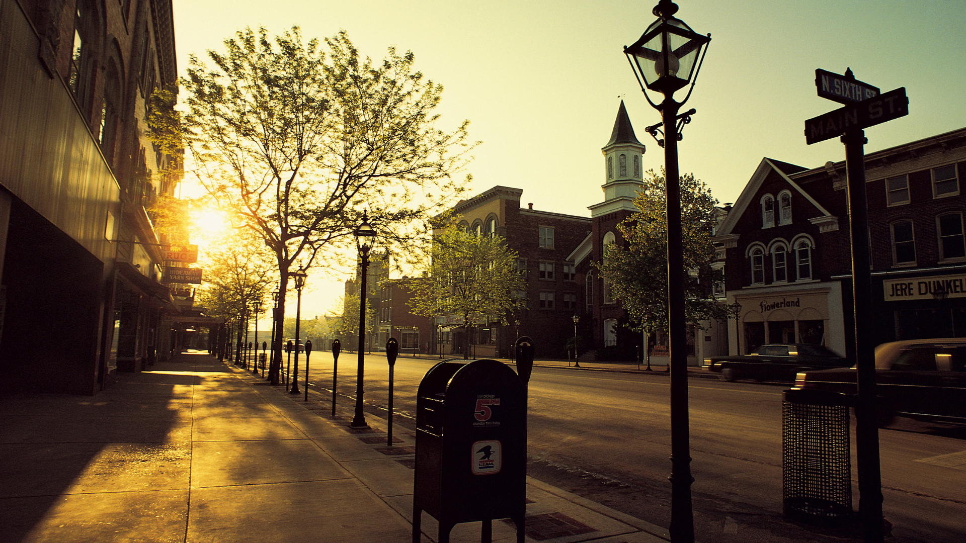 Sunrise on a quiet tree-lined street in downtown Belleville, Illinois