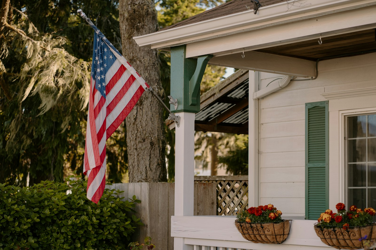 American flag on the front porch of a home, representing the Illinois disabled veterans property tax exemption