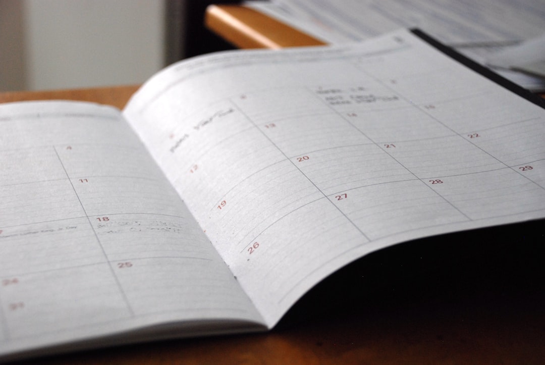 An open monthly planner on a desk, used to map out a home sale timeline